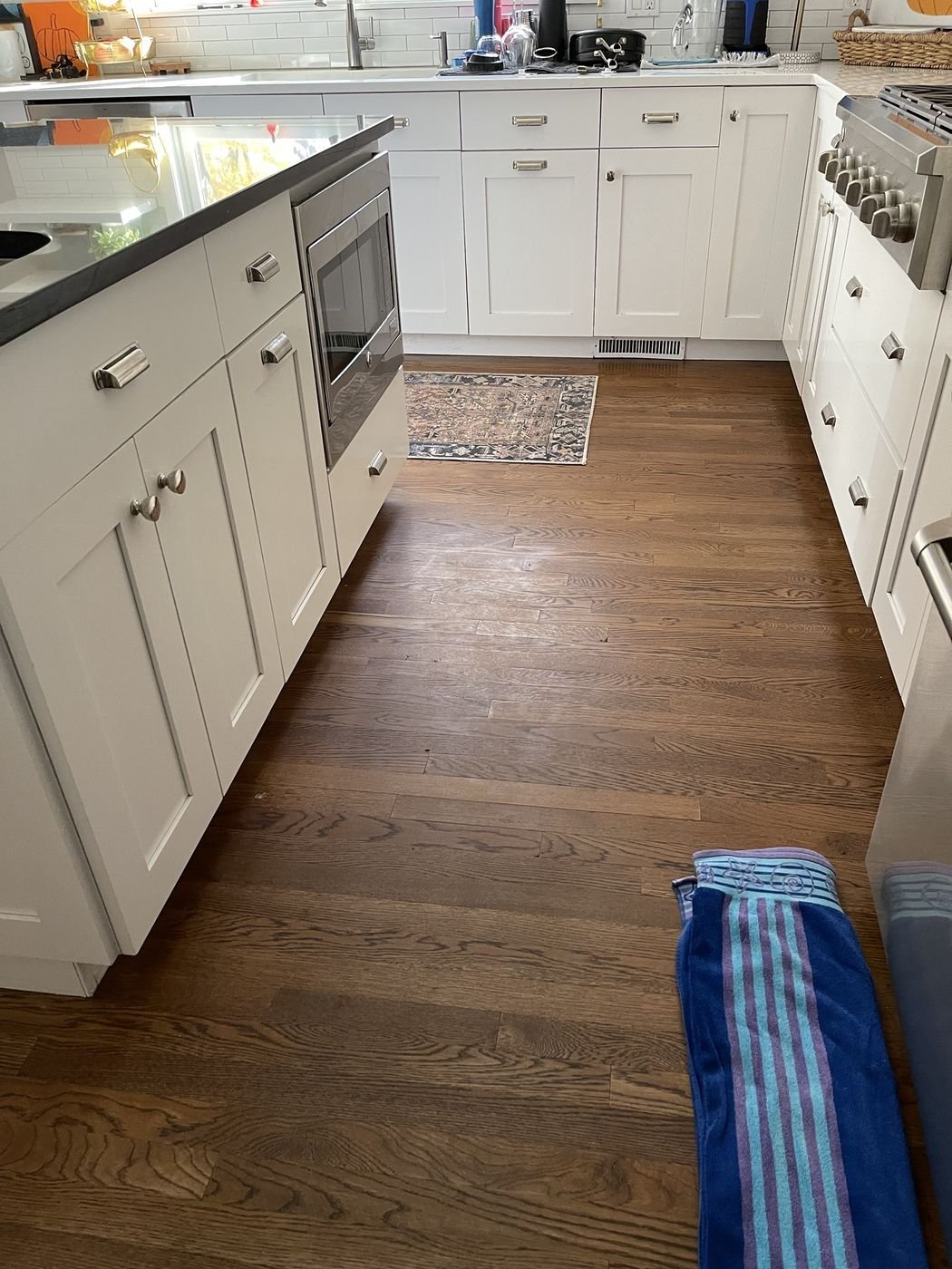 Kitchen hardwood floors before cleaning